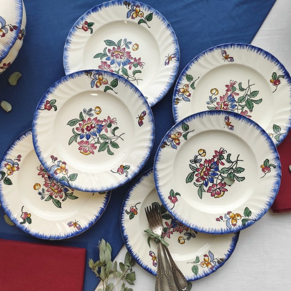 Rare ensemble de six assiettes plates en terre de fer Longwy modèle "Printemps".