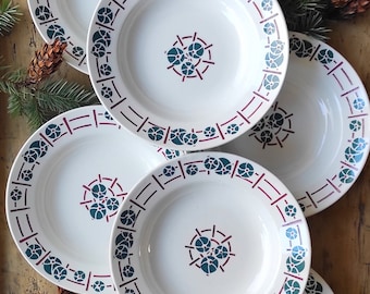 Set of six Pexonne iron earthenware soup plates.