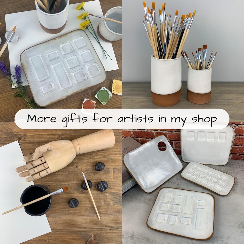 May include: A collection of art supplies, including paint palettes, paint brushes, and ceramic containers. The palettes are white with a brown trim. The image also includes a wooden hand model and the text "More gifts for artists in my shop."