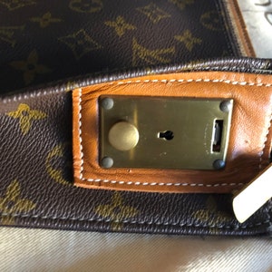 Louis Vuitton Keepall Bandouliere 50 with matted black and orange chain - LOUIS  VUITTON