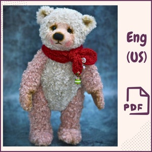 May include: A pink and white teddy bear wearing a red knitted scarf with a green and white bead charm. The bear is standing on a blue background. Eng (US) PDF.