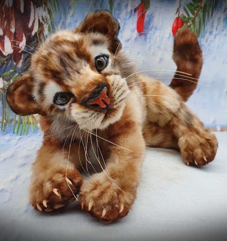 Sitting pose: Realistic tiger cub plush toy with blue eyes – handmade from sewing template