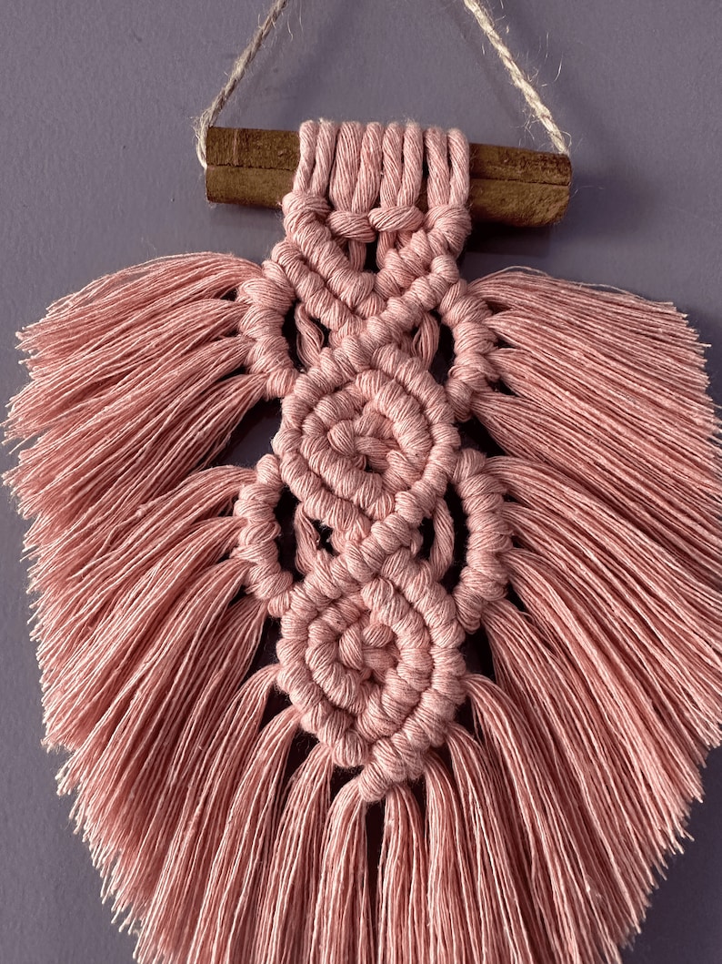 Light and airy macrame feather — feels like poetry in fiber. Designed to calm, made to give.