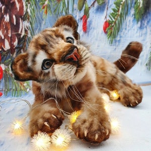 Lying, paw up: Realistic stuffed tiger in playful pose – handmade toy from digital template