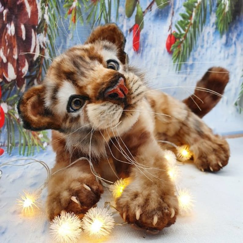 Lying, paw up: Realistic stuffed tiger in playful pose – handmade toy from digital template
