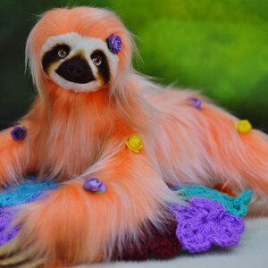 Side view of poseable stuffed sloth toy – printed pattern example