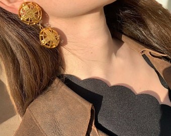 Boucles d’oreilles pendantes vintage en métal doré plaqué or Chanel