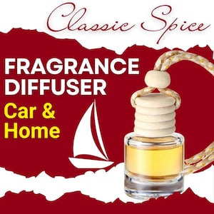 May include: A glass bottle with a gold cap and a gold string hanging from it. The bottle is filled with a yellow liquid. The bottle is labeled "Classic Spice Fragrance Diffuser Car & Home".