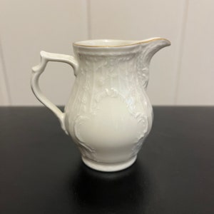 Vintage Rosenthal Classic Germany 4” white creamer with gilt trim & lovely raised details. Excellent condition