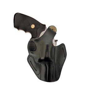 May include: A black leather holster for a handgun. The holster has a belt loop and a snap closure.