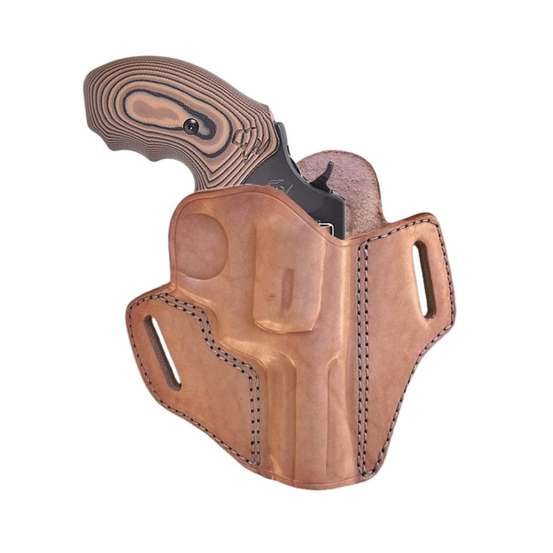 May include: A brown leather holster with a black revolver. The holster has a molded design with visible stitching and cutouts. The revolver's grip is wood-grained with black accents.
