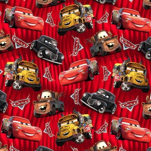 May include: A red fabric featuring a repeating pattern of characters from the movie Cars, including Lightning McQueen, Mater, and a yellow school bus, interspersed with the Cars logo on a background of vertical red stripes.