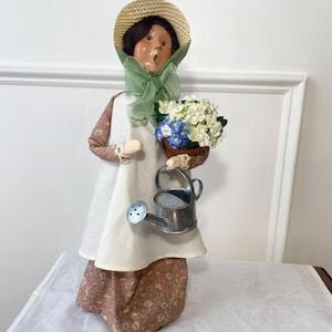 Byers&#39; Choice Gardening Woman Caroler Light Pink Floral Dress Watering Can and Flowers, 2003