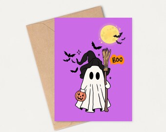 May include: A Halloween-themed greeting card featuring a cartoon ghost wearing a witch hat and holding a broom and a pumpkin. The card has a purple background with a full moon, bats, and the word "Boo". The card is on a brown envelope.