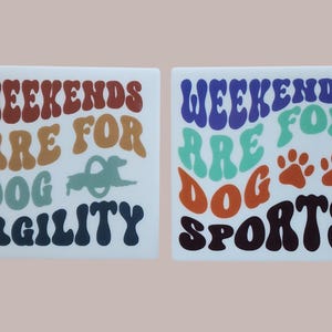 May include: Two square ceramic tiles with the text "WEEKENDS ARE FOR DOG AGILITY" and "WEEKENDS ARE FOR DOG SPORTS". The first tile has a dog agility graphic, the second has paw prints. The text is in retro font.