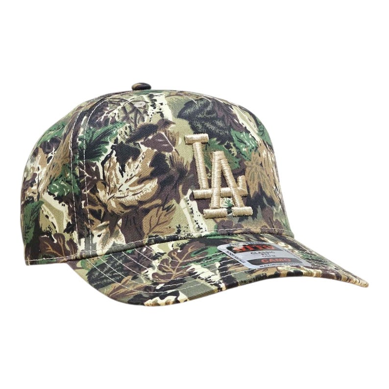 May include: A camouflage baseball cap with the letters "LA" embroidered on the front. The cap has a curved peak and a classic six-panel design. The hat is made of a durable fabric and has a structured fit.