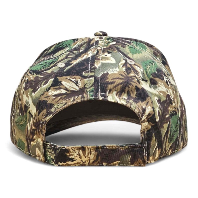May include: A camouflage baseball cap, seen from the rear, with a pattern of green, brown, and tan colours. The cap has a curved peak and an adjustable strap. The design is similar to woodland camouflage.