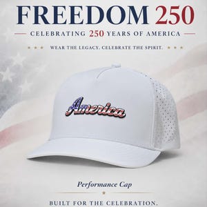 May include: A white performance cap featuring the word America in a stylized font with a red, white, and blue flag pattern. The cap has a solid front panel and perforated side panels. Text above reads Freedom 250 Celebrating 250 Years of America.