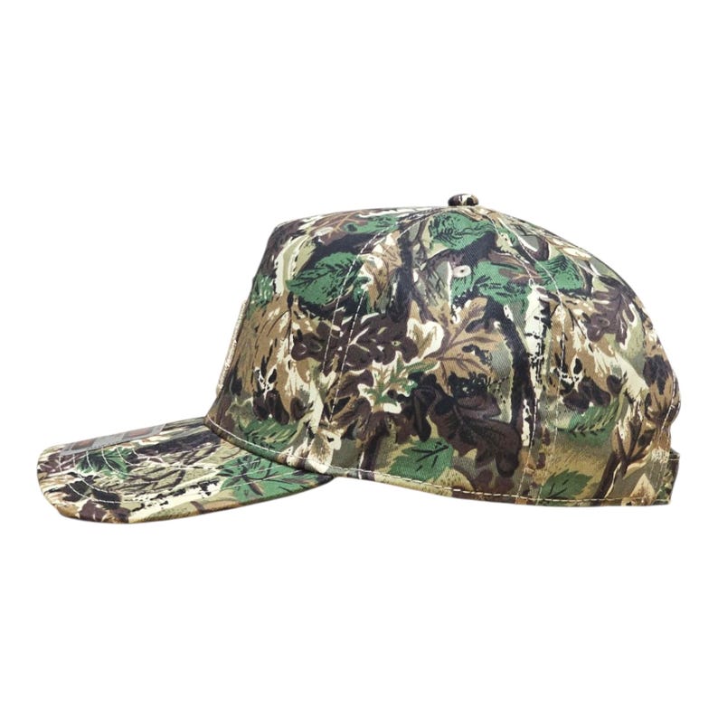 May include: A camouflage baseball cap with a pattern of green, brown, and beige foliage. The cap has a curved peak and a structured crown. The hat is designed for outdoor activities and provides sun protection.