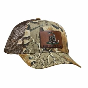 May include: Camouflage baseball cap with a brown mesh back and a curved peak. A brown leather patch features a coiled snake and the text "DON'T TREAD ON ME". The cap is made of Advantage brand fabric.