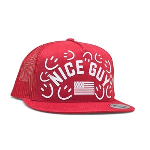 May include: Red trucker hat with white text that reads "NICE GUY" and a small American flag graphic. The hat has a mesh back and a curved brim. The hat is a standard size.