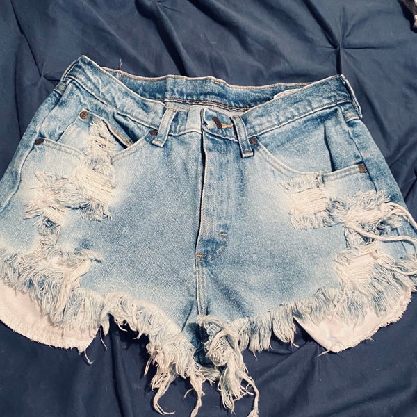 Women’s Wrangler distressed peekaboo booty shorts. Women’s Daisy Duke’s.