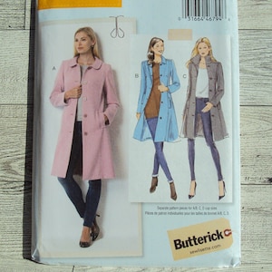 May include: A sewing pattern package for a women's coat, featuring illustrations of the coat in pink, blue, and gray. The package includes the brand name "lisette" and the pattern number B6385. The size range is (14-16-18-20-22).