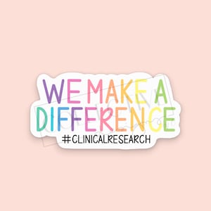 May include: A colorful sticker with the text "WE MAKE A DIFFERENCE #CLINICALRESEARCH". The text is in a rainbow color scheme with a white outline.