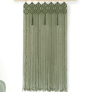 Artisan macrame door curtain providing a stylish privacy screen for a bedroom doorway.