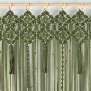 Large-scale olive green wall hanging used to add texture to an open-concept living space.