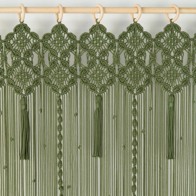 Large-scale olive green wall hanging used to add texture to an open-concept living space.