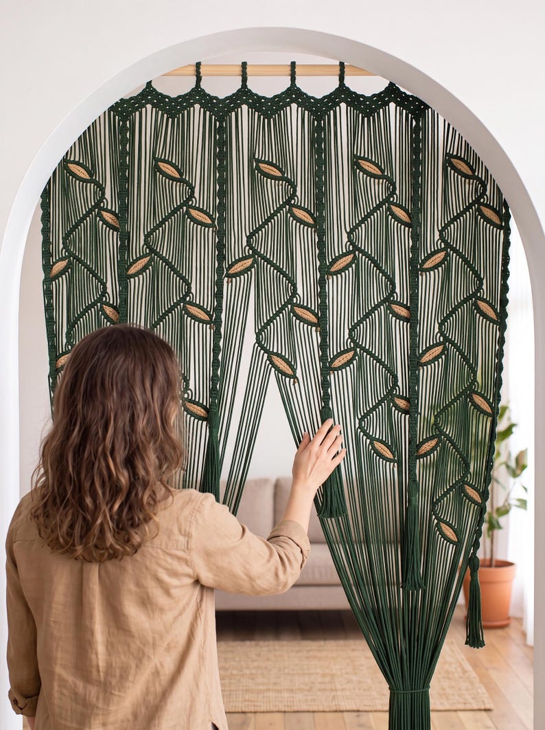 Deep green hand-knotted macrame backdrop tapestry featuring geometric vine lattice patterns and tassel details