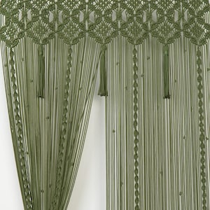 Boho room divider providing a soft, organic transition between a living room and hallway.