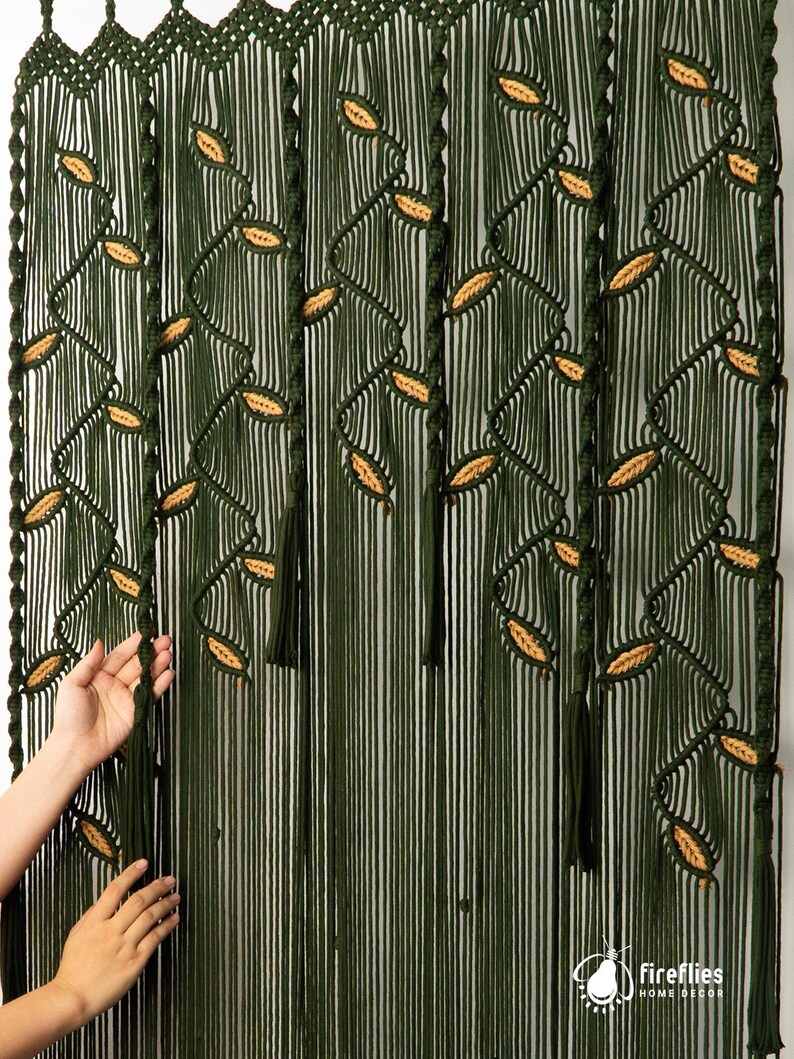 Long-form forest green macrame curtain with contrast-color latte leaf highlights.