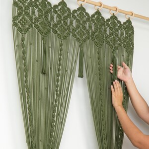 Geometric olive green door hanging styled over a walk-in closet for a bohemian look.