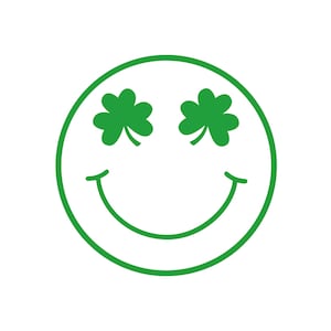 May include: A green smiley face with shamrock leaves for eyes.