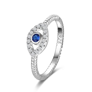 May include: Silver ring featuring a blue evil eye design. The eye is surrounded by clear cubic zirconia stones. The band is textured and has the number 925 stamped on it.