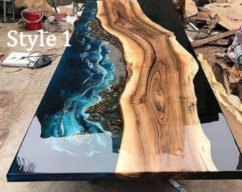 May include: A rectangular wooden table with a unique design. The table features a live edge on one side and a blue and white epoxy resin river on the other. The text "Style 1" is visible on the left side of the table.