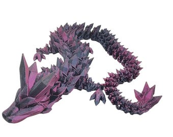 May include: A 3D printed dragon figurine made of black and pink plastic. The dragon is posed in a crawling position with its head raised and its tail curled around its body. The dragon's scales are detailed and textured, giving it a realistic appearance.