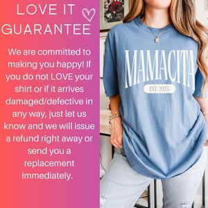 a woman wearing a blue shirt with the words love it guarantee