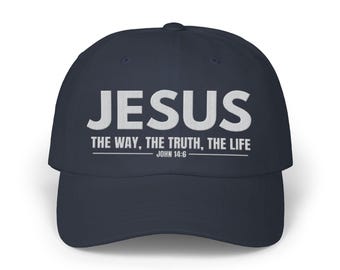 May include: Navy blue baseball cap with the word "JESUS" embroidered in white. The text "THE WAY, THE TRUTH, THE LIFE" and "JOHN 14:6" are also embroidered in white. The cap is labeled "EMBROIDERED" and "VARIOUS COLORS".