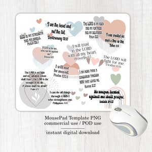 May include: A mousepad with a pink, gray, and green color scheme featuring inspirational bible verses in a heart shape. The text includes verses such as "God is my strength and my shield" and "No weapon formed against me shall prosper".