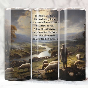 May include: A white tumbler with a scenic image of a shepherd with a flock of sheep in a green field with a river and mountains in the background. The text on the tumbler reads: "In infinite wisdom, the Lord surely knew that we would need a pastor as faithful as you. A love of God's word, and a heart for His flock, you give of yourself, and you stand on the rock."