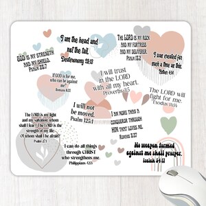 May include: A white background with pink, blue, and green hearts containing inspirational bible verses. The verses are in black text and include quotes such as "God is my strength and my shield" and "No weapon formed against me shall prosper."