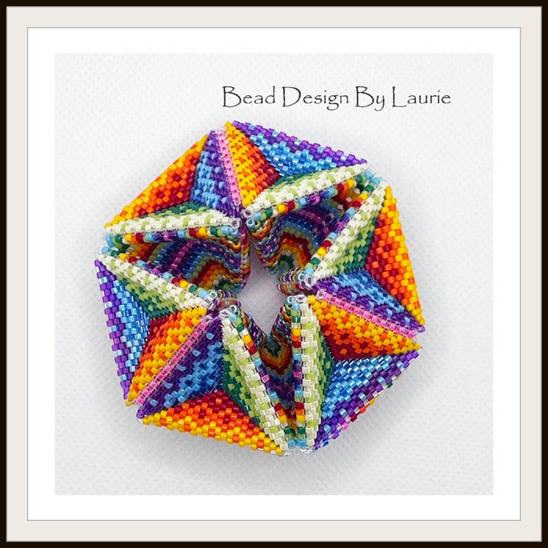 May include: A colorful beaded bracelet with a geometric design. The bracelet is made of small, colorful beads that are arranged in a pattern of triangles. The bracelet is a vibrant and eye-catching piece of jewelry.