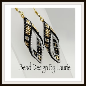 May include: A pair of handmade beaded earrings with a leaf-like design. The earrings feature a pattern of black, white, and gold beads. The text "Bead Design By Laurie" is visible at the bottom of the image.