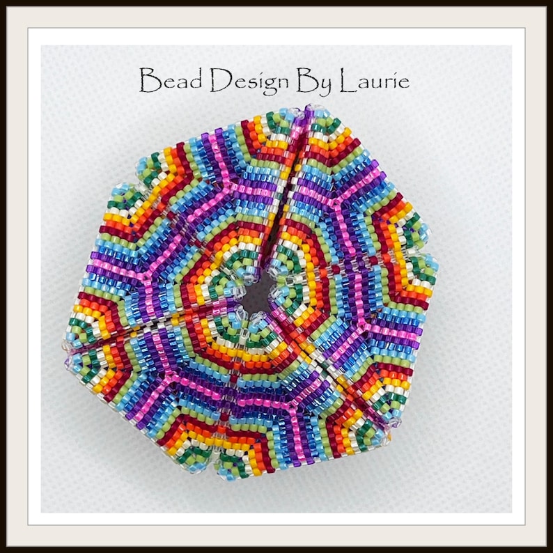 May include: A colorful beaded hexagon with a rainbow pattern. The beads are arranged in a geometric design, creating a kaleidoscope effect.