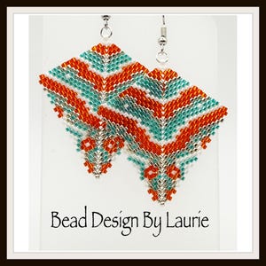 May include: A pair of diamond-shaped dangle earrings crafted from small glass beads in orange, turquoise, white, and metallic silver. The beads are arranged in a chevron pattern. The earrings hang from silver-toned metal hooks on a white card.