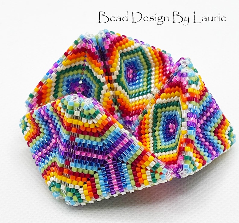 Rainbow Kaleidocycle Digital Peyote This is a digital pattern on how to make a beaded 3D peyote Kaleidocycle. I have included a tutorial on how to make the Kaleidocycle with pictures and a word chart and list of beads needed. Pattern.