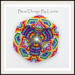 May include: A colorful beaded geometric shape with a rainbow pattern. The shape is made of small beads and has a star-shaped opening in the center. The text "Bead Design By Laurie" is printed above the shape.